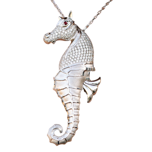 Diamond seahorse pendant on a fine chain