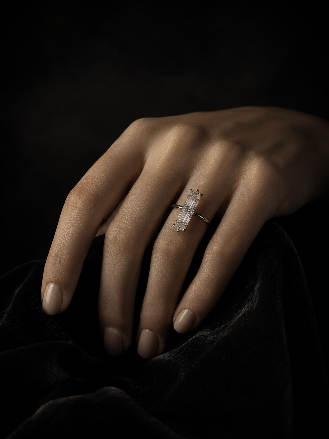 Elongated baguette diamond solitaire ring